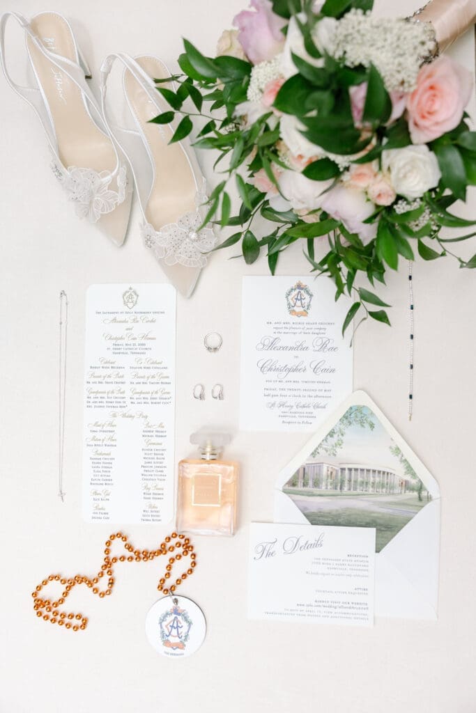 wedding details for wedding at the tennessee state museum with Custom Mardi Gras beads with wedding crest at Nashville reception