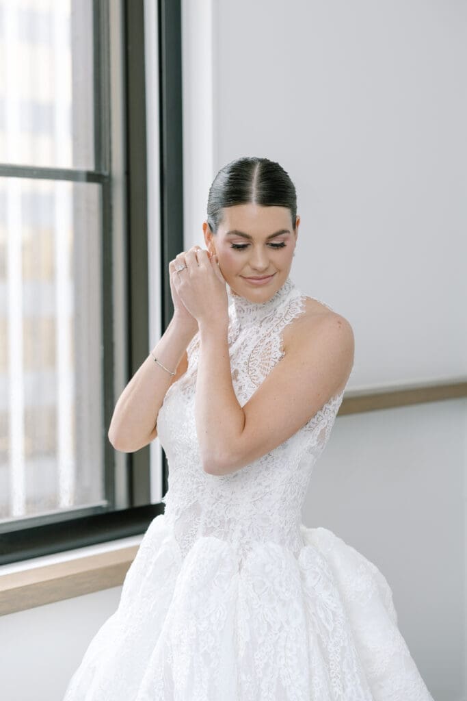 Bride getting into her wedding dress at The Noelle Hotel downtown Nashville