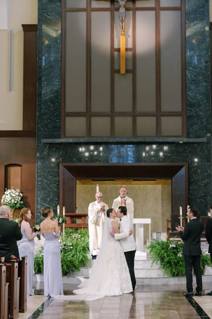 Bride and groom exchanging vows at St. Henry Catholic Church Nashville