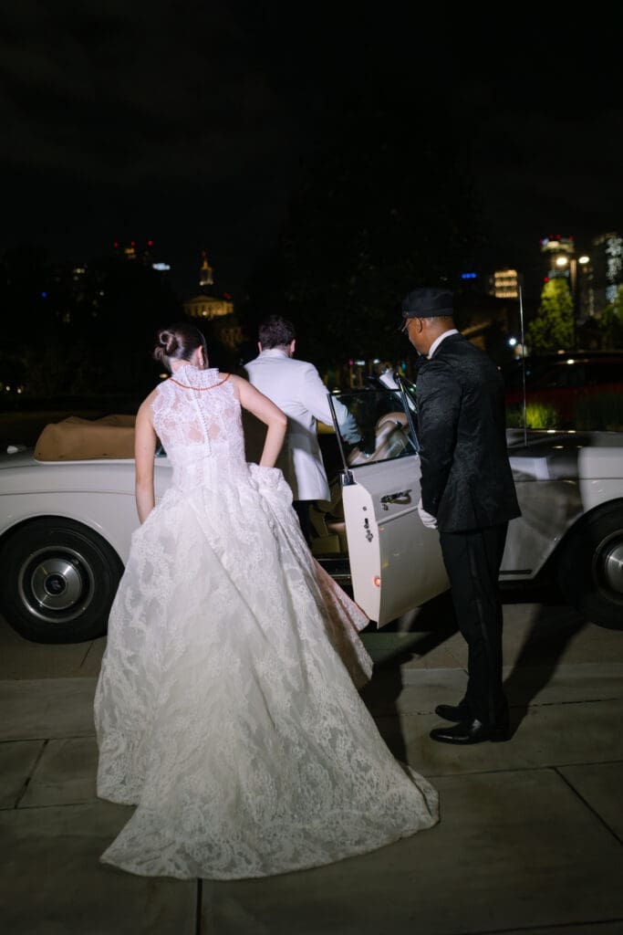 Bride and groom cold spark exit into vintage Rolls Royce Nashville wedding