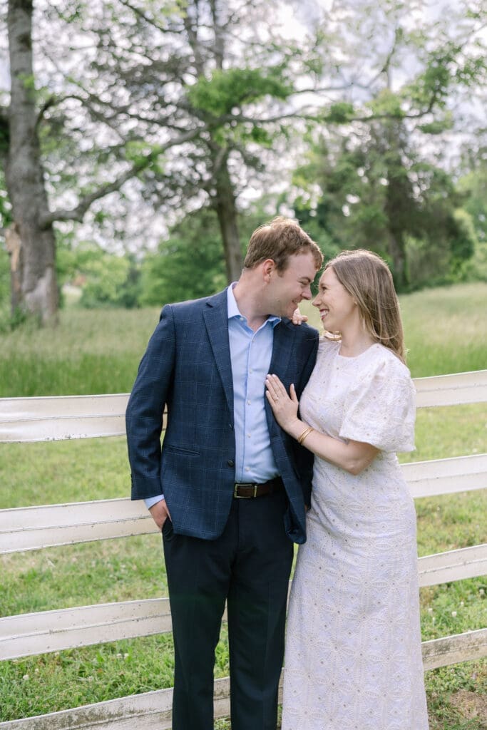 Smiling engaged couple embracing during spring Nashville Tennessee engagement photography session