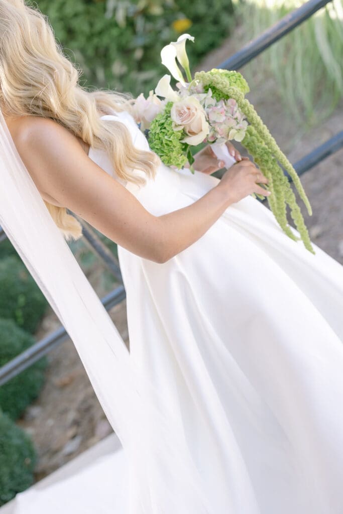 getting ready photos of the bride from A Fall Wedding at The Venue at Birchwood in Spring Hill, TN with her gorgeous bouquet by Larson Floral Design Co