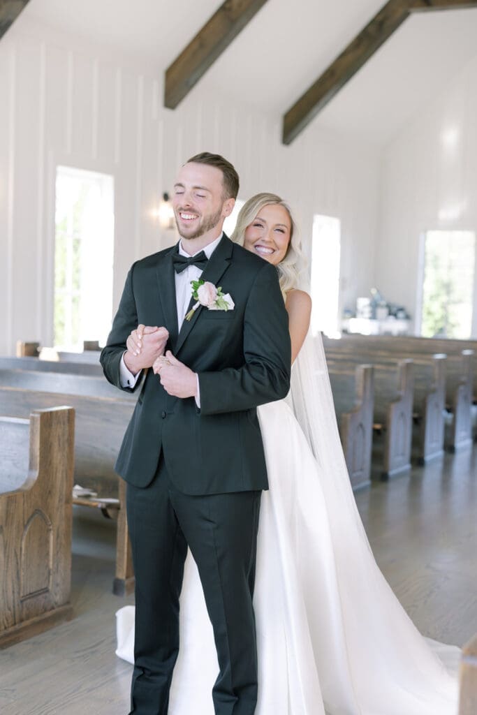 first look between couple at A Fall Wedding at The Venue at Birchwood in Spring Hill, TN with her gorgeous bouquet by Larson Floral Design Co