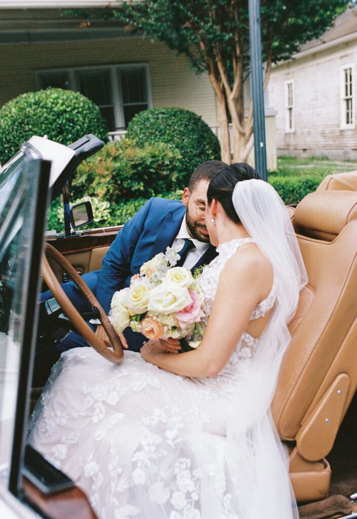 bride and groom portraits with classic rolls royce in downtown franklin, tn on film