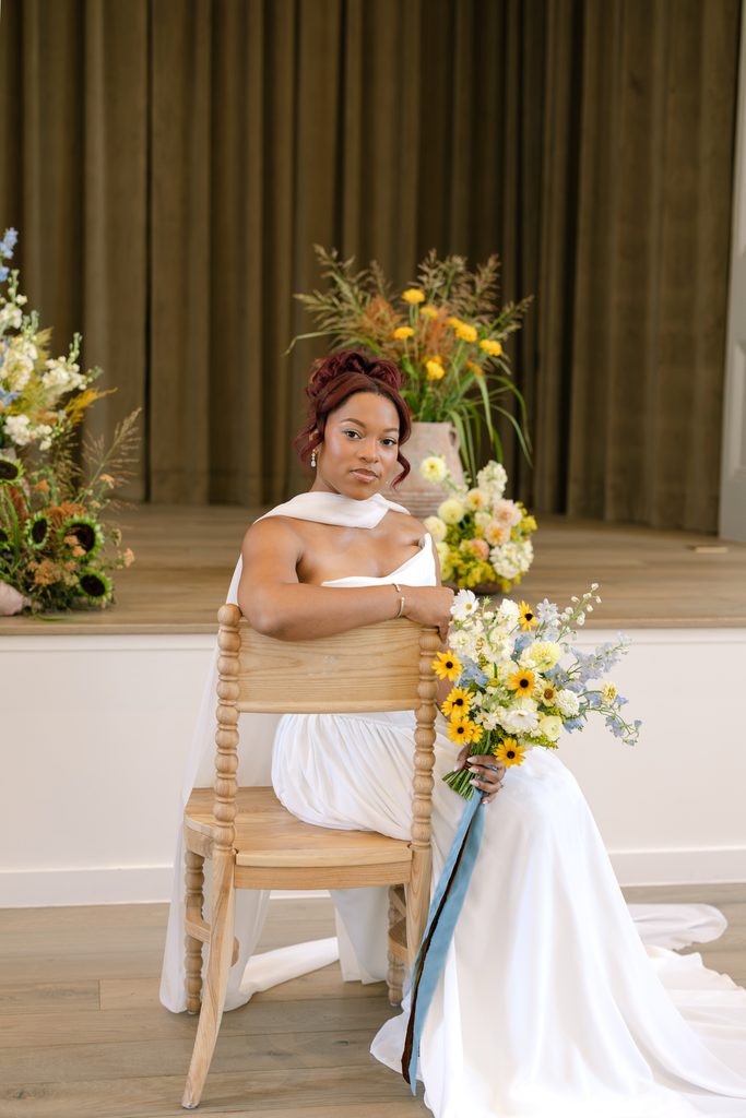 Summer heirloom wedding color palette featuring soft yellows, dusty blues, and deep greens
