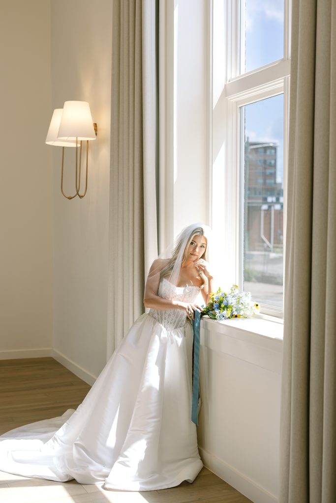 Bride wearing a soft, romantic wedding gown from A&Bé Bridal Shop