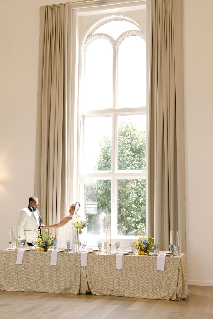 Luxury wedding tablescape styled with Curated Events rentals in warm heirloom tones